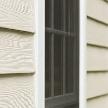 HardiePlank Lap siding with Cedarmill wood grain texture is complimented by HardieTrim trim boards in this window detail