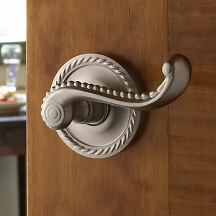 Baldwin decorative Estate lever in satin nickel with large decorative rose compliments the natural wood door