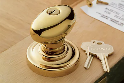 The traditional keyed entry lock in a simple brass egg knob design with classic rose is part of the Baldwin Estate Collection of solid forged brass architectural hardware