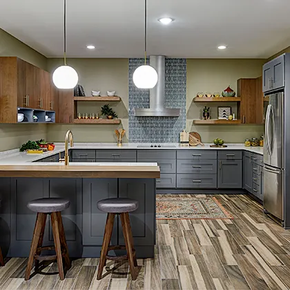 Bayfield and Mesa door styles compliment this mid century modern kitchen in dark grey and Cherry wood with an acorn finish
