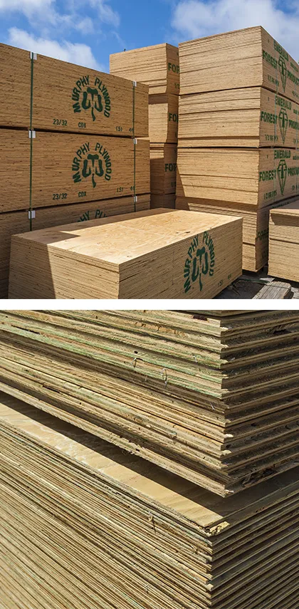 Stacks of CDX plywood and T&G pressure treated plywood stacked in our yard
