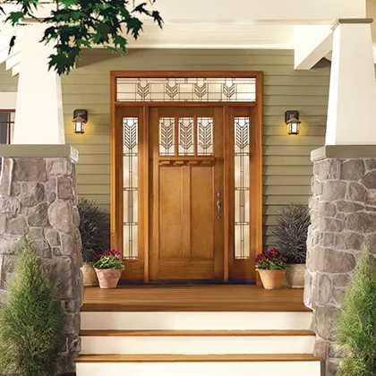 The curb appeal of this Craftsman style fiberglass door with divided lites, and transom and sidelites with decorative glass enhance the wide porch