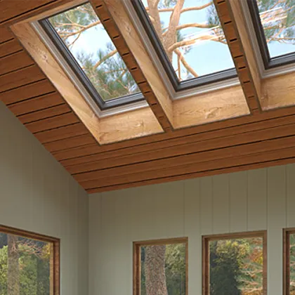 Living room filled with light and views is complemented by the natural wood pitched ceiling and three VELUX Skylights