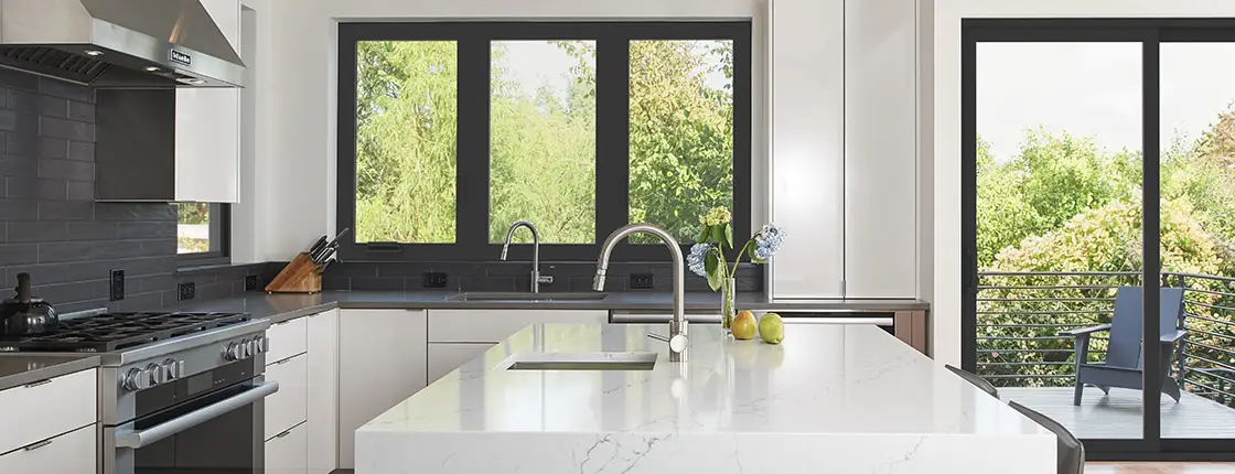 Milgard C700 Series fiberglass windows and sliding patio door installed in a modern residential home