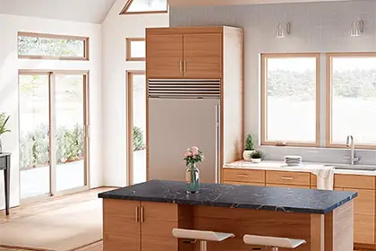 Modern kitchen with MILGARD V300 Series Trinsic vinyl windows and sliding patio door letting in natural light