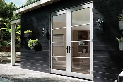 MILGARD V400 Series Tuscany outswing French patio doors opening to an outdoor patio area